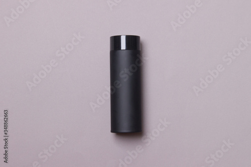 black thermos cup on grey background