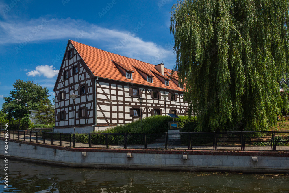 Historic building (White Granary) on the Brda river in Bydgoszcz, Poland