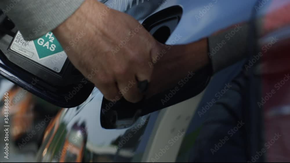 Hydrogen car is being refueled at hydrogen gas station Hydrogen car is being refueled at hydrogen gas station