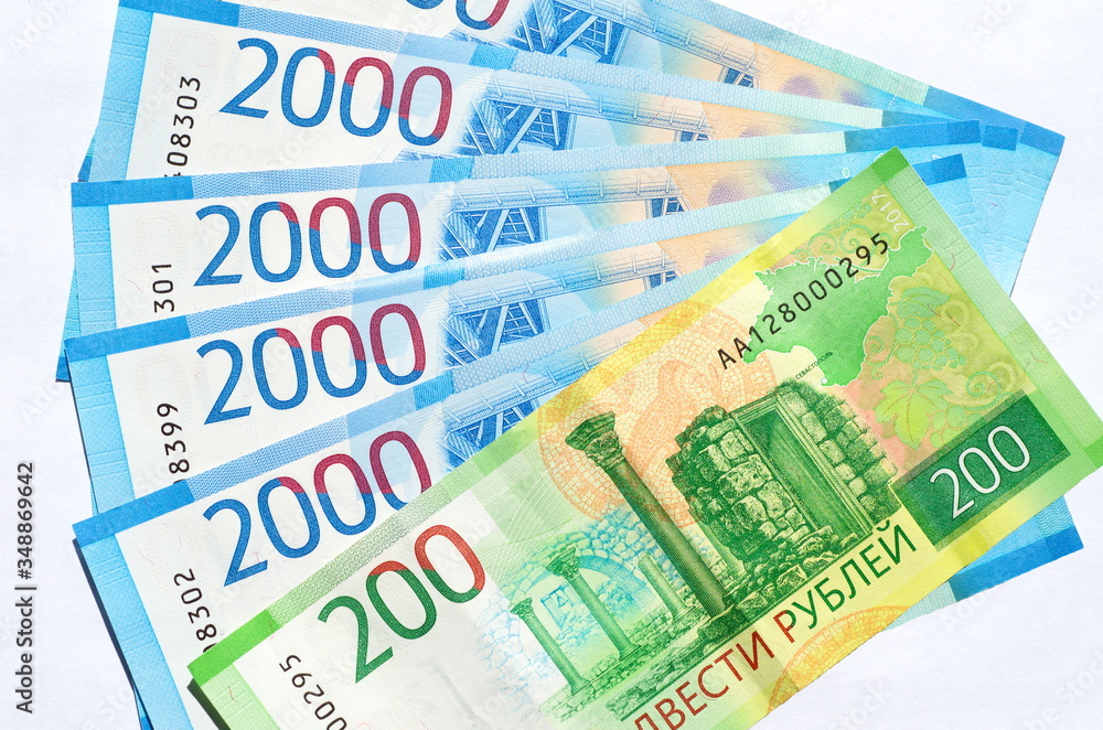Russian money. New banknotes in denominations of two thousand and two hundred rubles on a white background Russian money. New banknotes in denominations of two thousand and two hundred rubles on a white background
