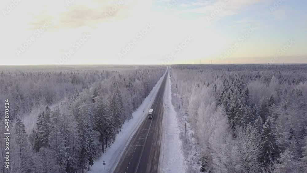 Aerial view of winter forest road, aerial top view. Winter driving Aerial view of winter forest road, aerial top view. Winter driving