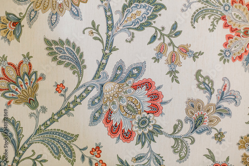 Pattern wallpaper of tropical dark green leaves and flower.