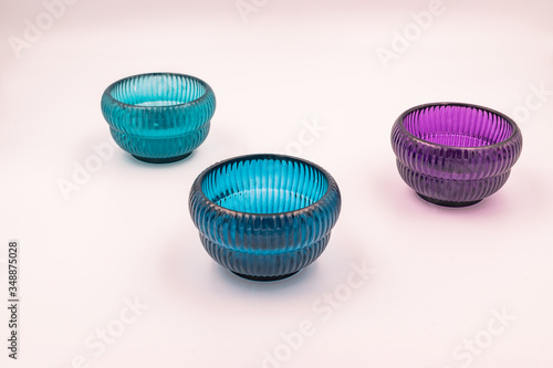 Modern minimalist blue and purple glass home decor items close-up