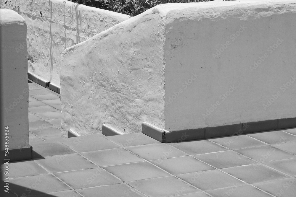 stairs exit down between the brick barrier outside the building stairs exit down between the brick barrier outside the building