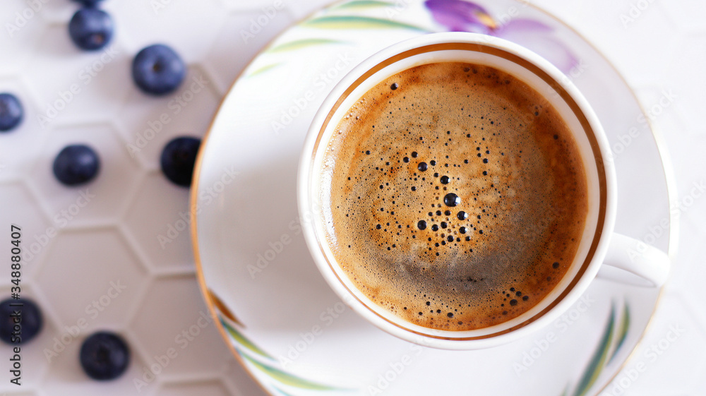 Fototapeta premium cup of coffee on a table