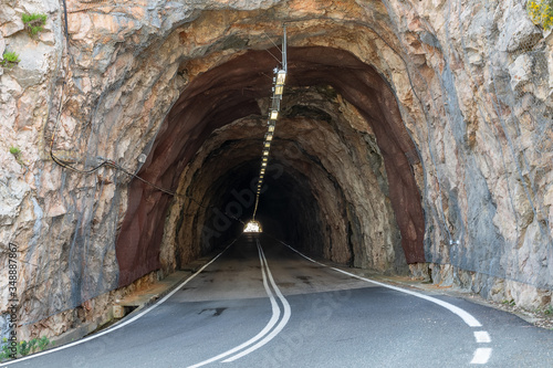 Underground landscape, a light shine at the end of the road tunnel