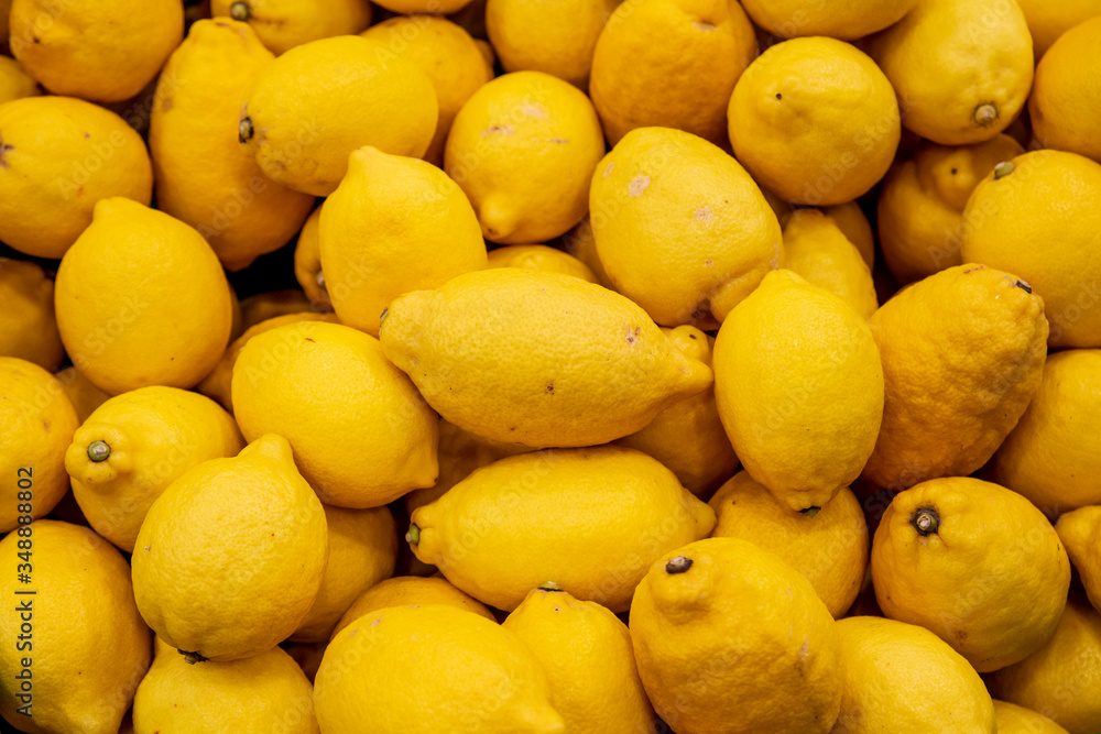 Colorful Display Of Lemons In Market.