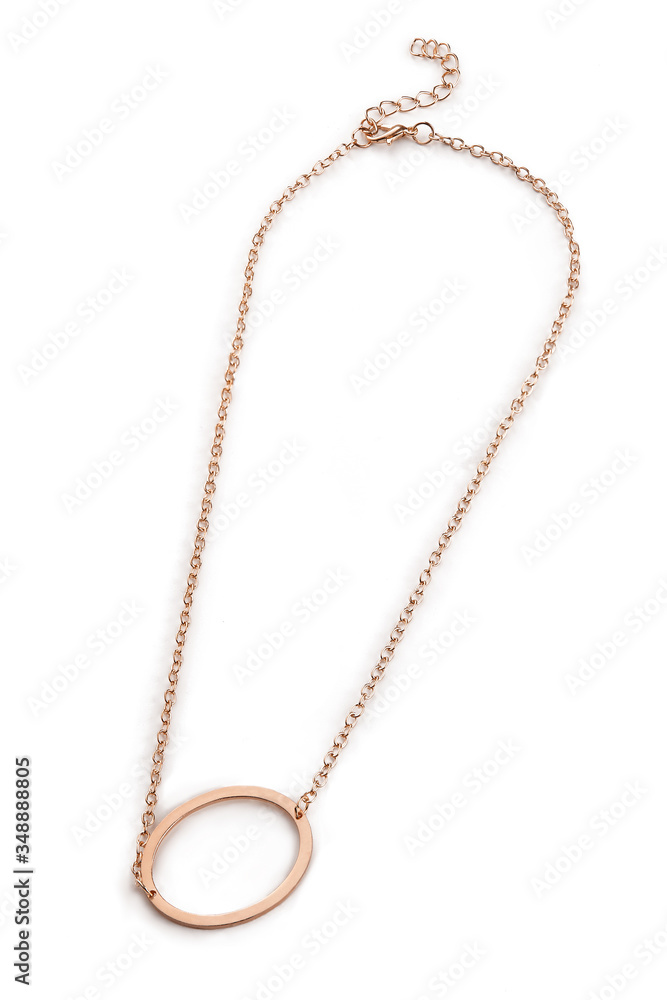 Subject shot of a golden chain with a pendant in the shape of a letter O. The fashion necklace is isolated on the white background. Subject shot of a golden chain with a pendant in the shape of a letter O. The fashion necklace is isolated on the white background.