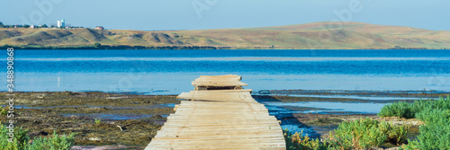 Old wooden jetty or pier at a lake or sea