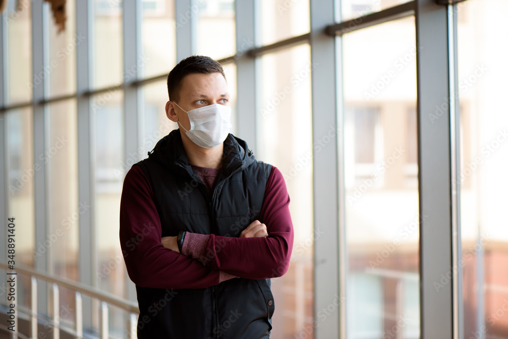 Sick man wearing a face mask in quarantine zone. New coronavirus (2019-nKoV) infection or Wuhan coronavirus Sick man wearing a face mask in quarantine zone. New coronavirus (2019-nKoV) infection or Wuhan coronavirus