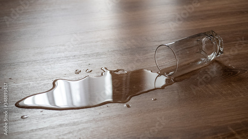 Spilled glass of water on a laminate