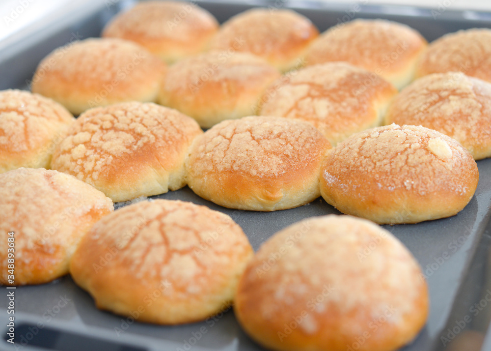 Baked buns on tray. Baking at home