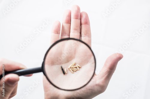 microchip and rice on the hand, size comparison, chipping