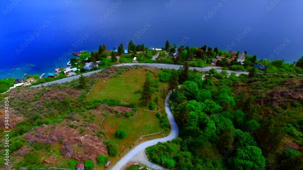 Large beautiful home horse ranch on the side of the mountain near large Lake Chelan in Eastern Washington. Home exteriors and green landscaping.
Large beautiful home horse ranch on the side of the mountain near large Lake Chelan in Eastern Washington. Home exteriors and green landscaping.