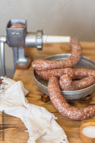 Making homemade meat sausage with a rustic meat grinder