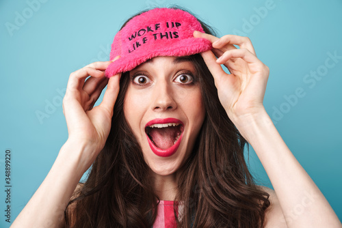 Image of delighted nice woman in sleeping mask screaming at camera