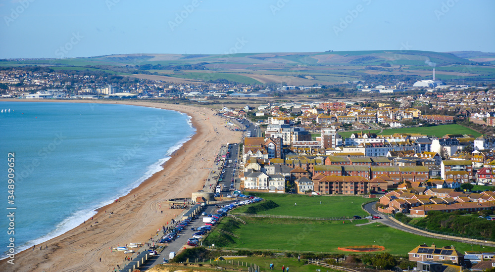 Panoramic view of Seaford, a small coastal resort town in East Sussex, UK, from the Seaford Head, with its long beach. Seaford lies on the south coast of England, close to Seven Sisters cliffs