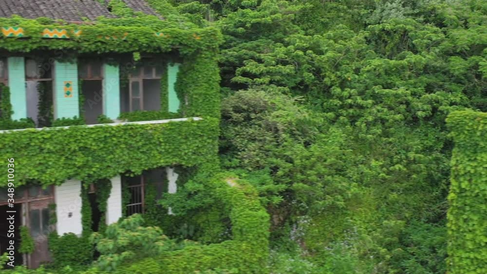 Houtouwan, Zhejiang China - Aerial view of China's abandoned fishing village. Plants Are Taking Over This Abandoned Fishing Village. Houtouwan, Zhejiang China - Aerial view of China's abandoned fishing village. Plants Are Taking Over This Abandoned Fishing Village.