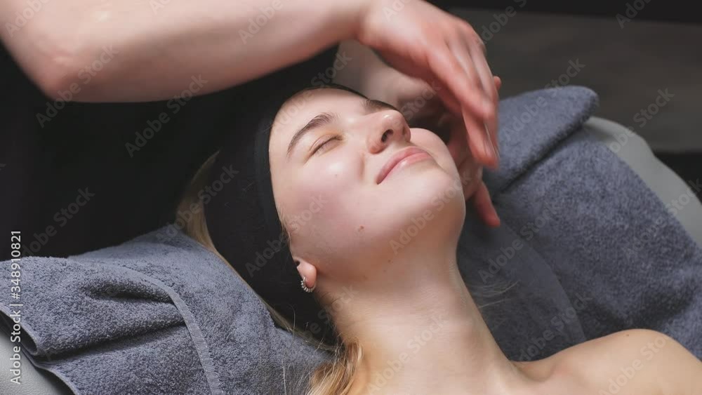 young woman in a chic beauty salon gets a facial massage and beauty treatments for skin care. young woman in a chic beauty salon gets a facial massage and beauty treatments for skin care.