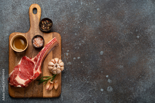 Raw marbled meat steak on wooden board