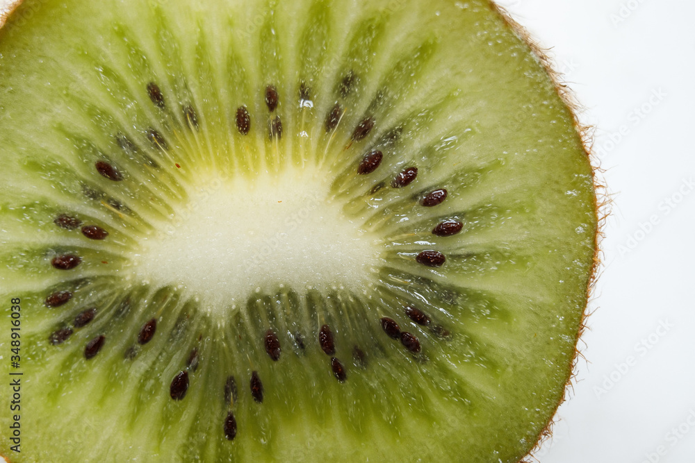 Slice of kiwi fruit isolated on white background Slice of kiwi fruit isolated on white background