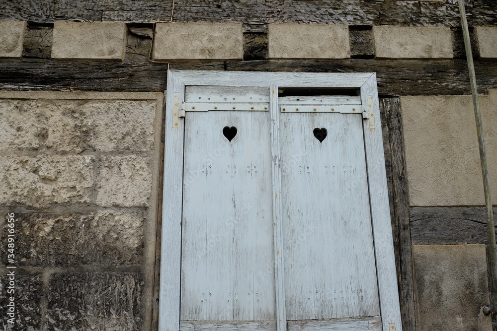 old wooden door decorated with hearts