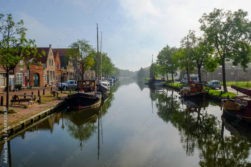 
Edam canals at dawn with the fog