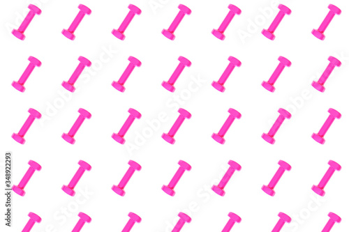 Pink dumbbell pattern on white background, isolated. Creative layout for sport fitness equipment, concept. Minimal style, flat lay, top view. Copy space.
