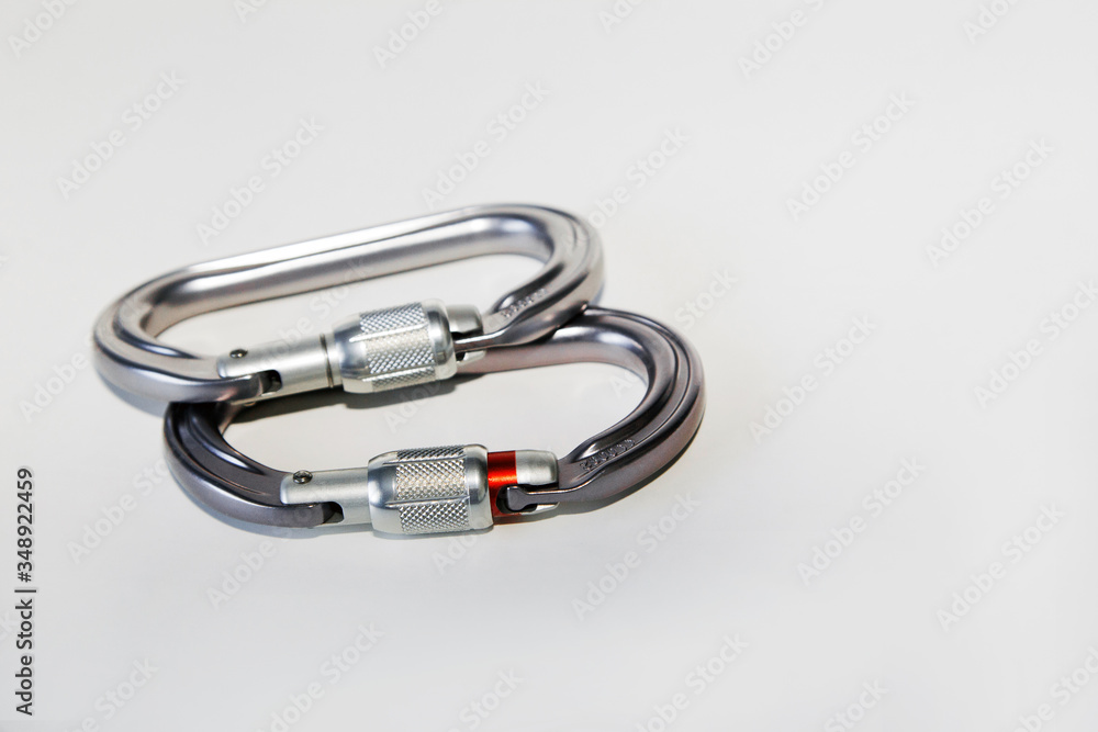 Carabiners for mountaineering, rock climbing and caving on a white background. Carabiners for mountaineering, rock climbing and caving on a white background.