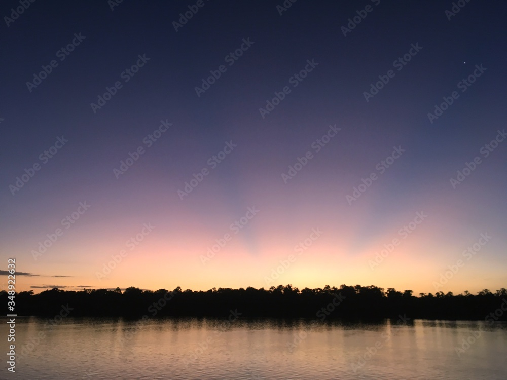Twilight scenery on a digul river Indonesia Twilight scenery on a digul river Indonesia