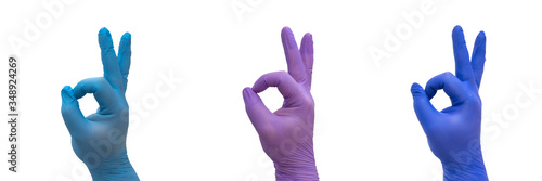hand with medical glove doing the OK gesture, symbolizing the win over COVID-19