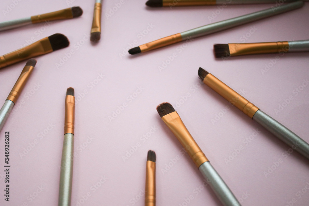 Makeup brushes on a pink background Makeup brushes on a pink background