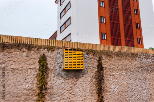 Low angle view of terraces and windows in modern buildings on cloudy day photo