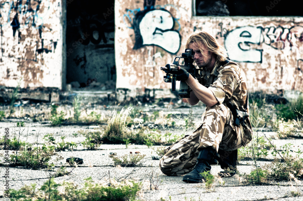 Fototapeta premium military with a rifle in his hands