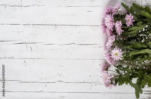 pink flowers on a wooden background