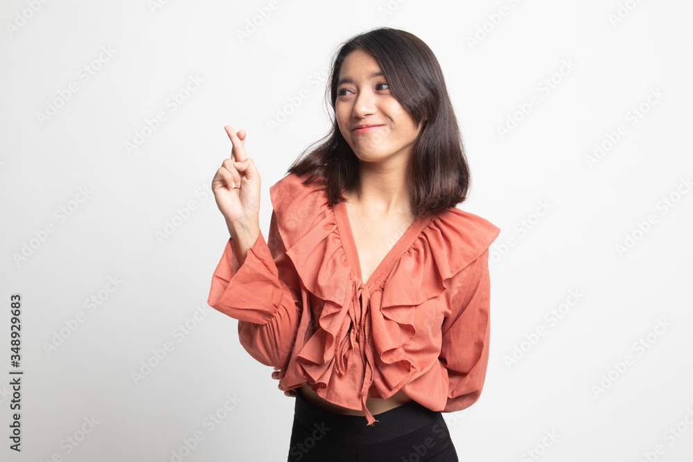 Beautiful young Asian woman cross finger . Beautiful young Asian woman cross finger .