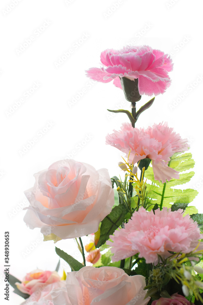 Beautiful colorful decoration artificial flower isolated on white background.