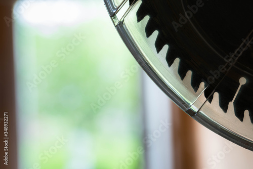 Silhouette of a miter saw blade with plastic safety cover close up shot, copy space. photo