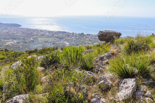 Billede på lærred Italy, Lazio - The built-up area of Formia seen against the light of Monte Campe