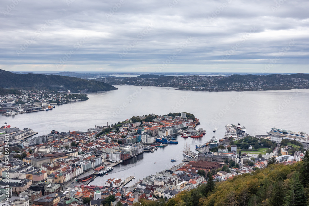 Bergen old town and Northern sea panoramic aerial view from Floyfjellet observation deck on cloudy autumn cold day. Bergen, Norway 