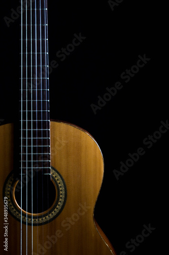 classic spanish guitar on black background