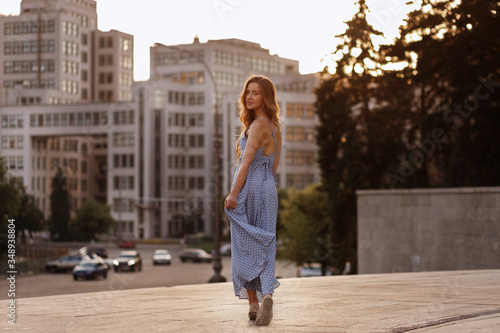 Obraz na plátně model on a summer walk in the city