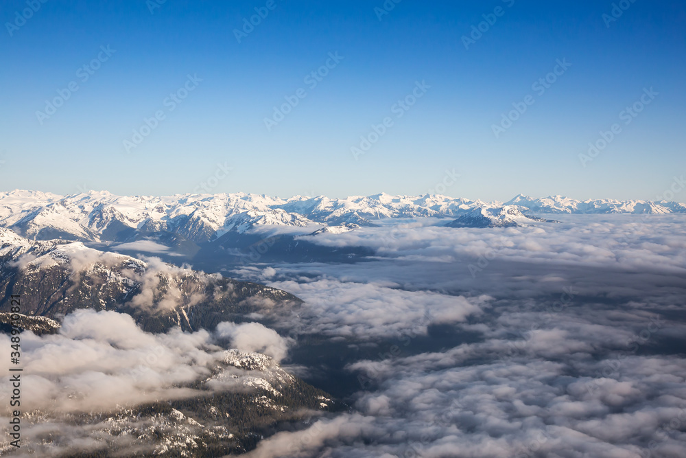 Aerial View of Remote Canadian Mountain Landscape during sunny morning. Located near Vancouver, British Columbia, Canada. Nature Background. Authentic