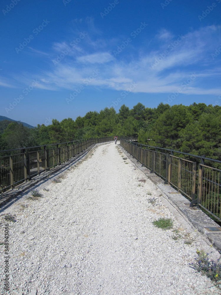 View of the bridge of the mtb bike trail Spoleto Norcia that goes on the track of a former railway (ex ferrovia) in Umbria, Italy