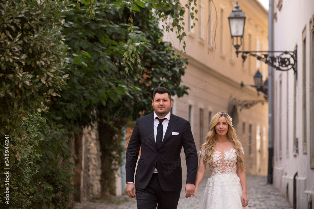 bride and groom walking on the street bride and groom walking on the street