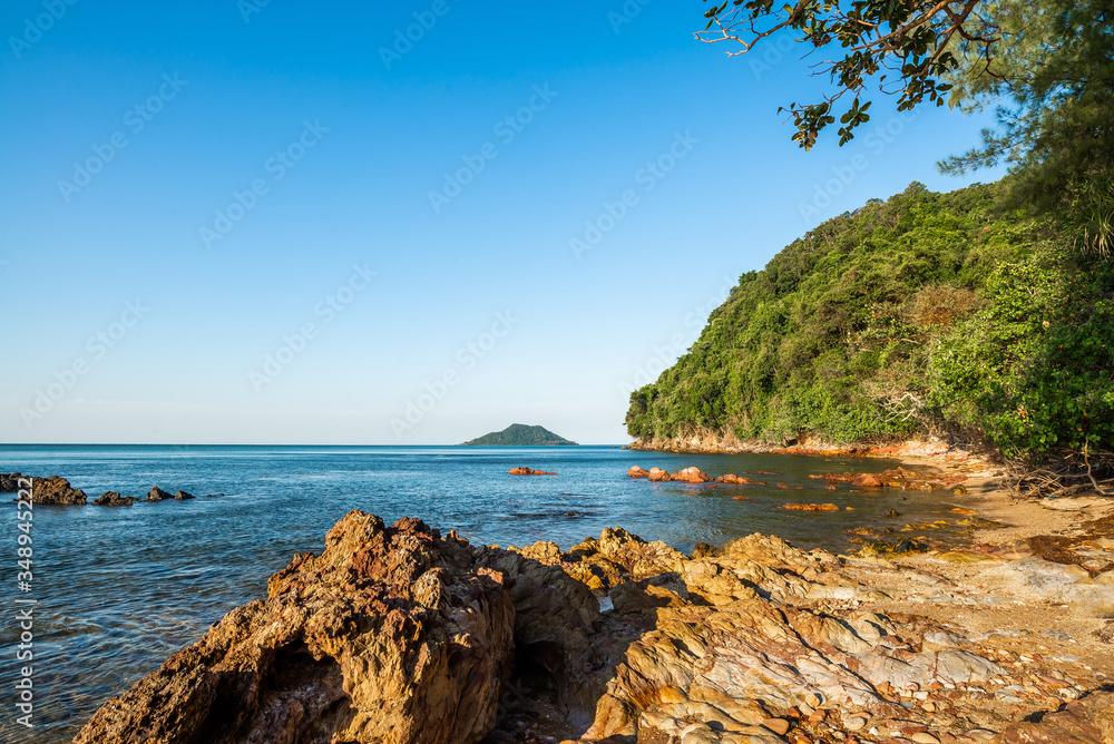 Beach and Large boulders on the sea coast. Beautiful rock pattern on the beach. Blue sea and blue clear sky. Panoramic view, travel location. Beauty in nature. Krating Bay, Chanthaburi ,Thailand.