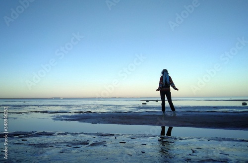 Girl walking on the beach