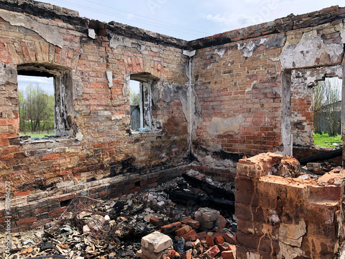 Burned house after fire, ruined building room inside, disaster or war aftermath concept
