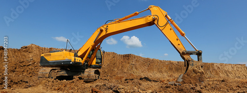 The excavator performs work at the quarry.