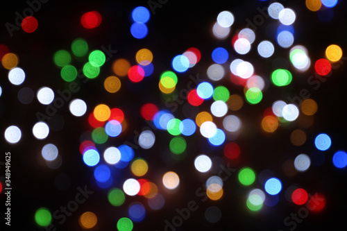 The multicolored bokeh can be obtained from indoor decorations.